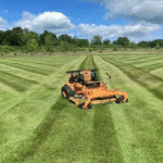 Hero image of lawn mower in freshly cut grass